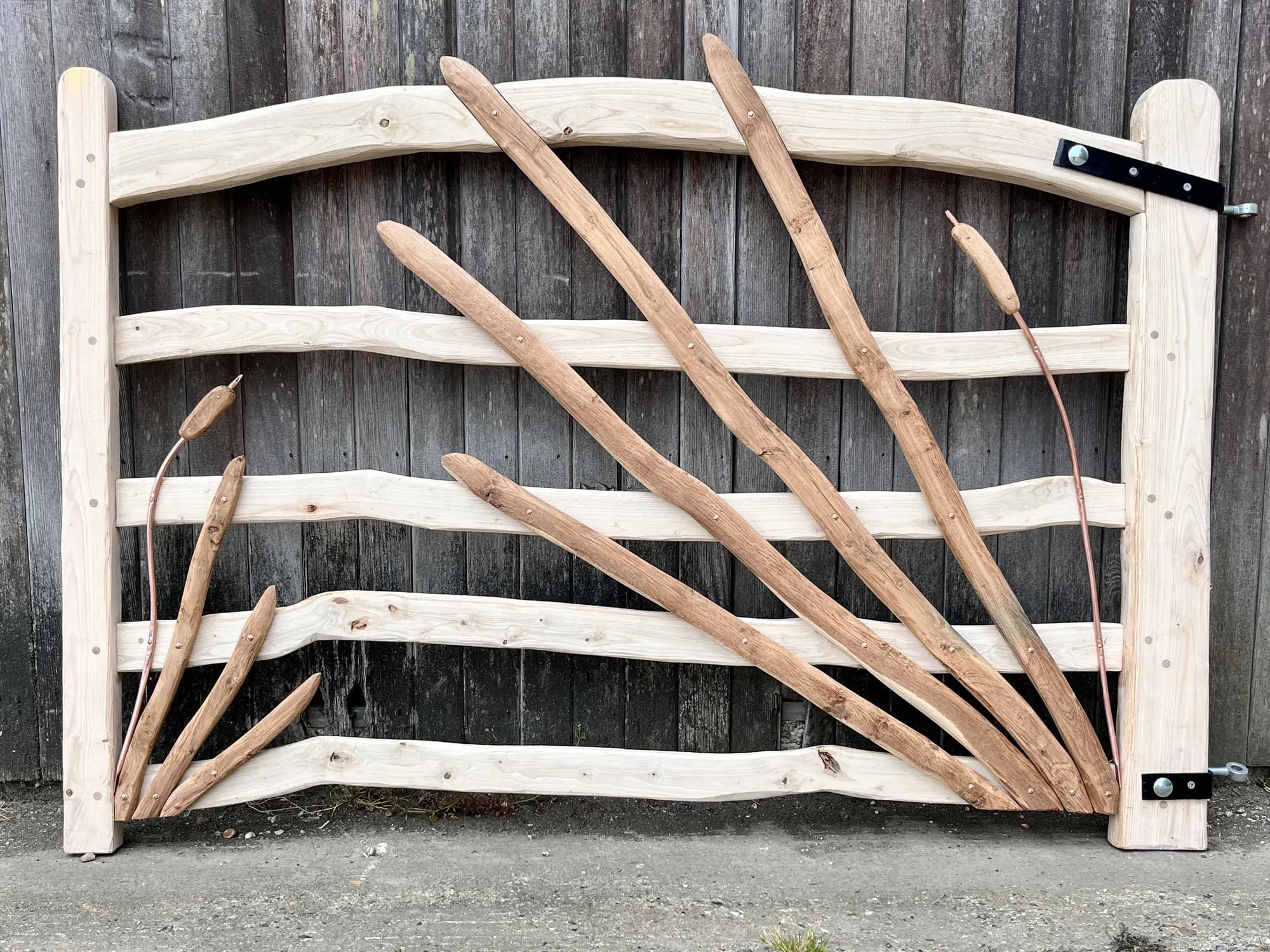 full bulrush-reed gate against barn