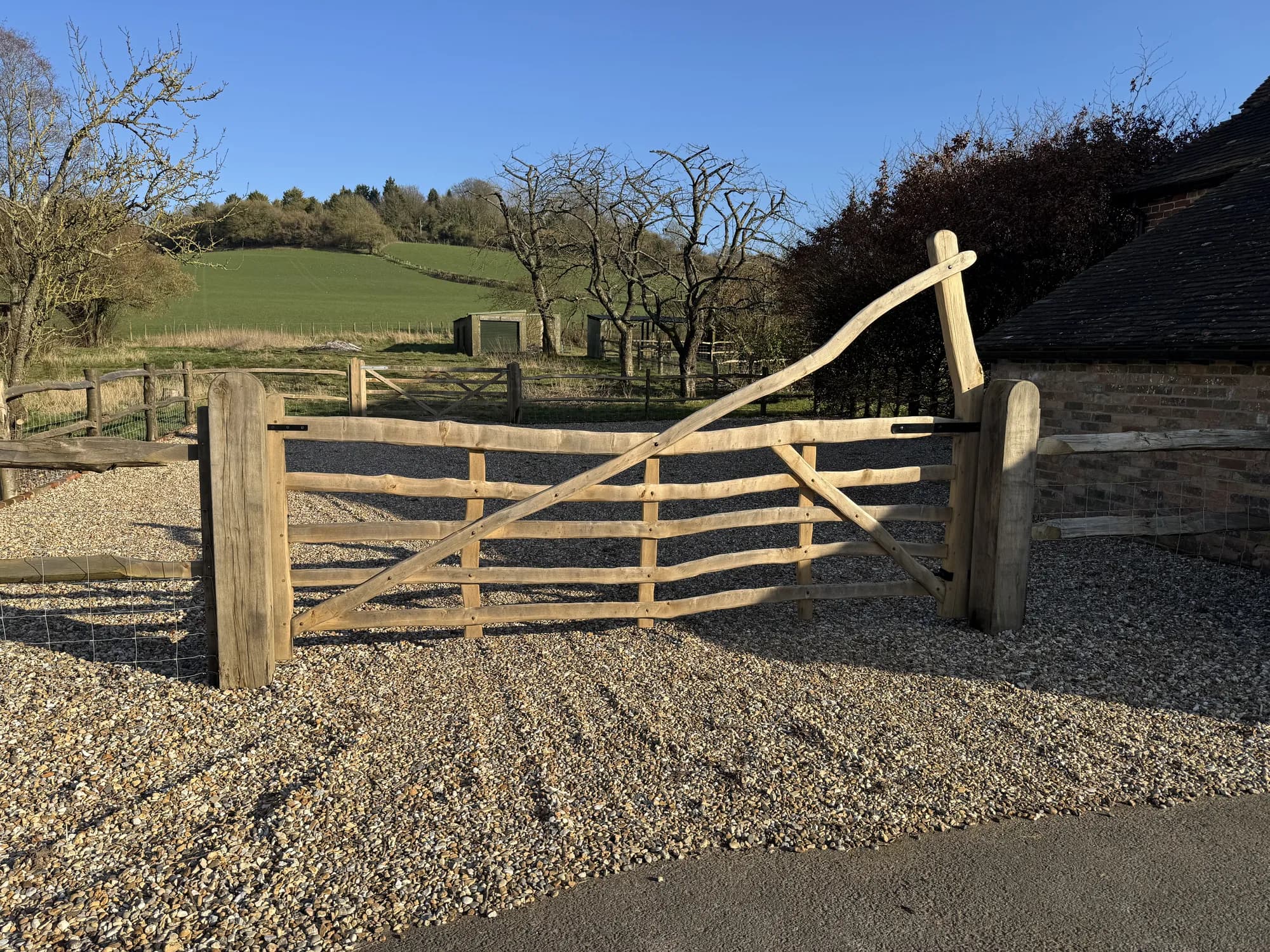 curved rising five-bar gate countryside