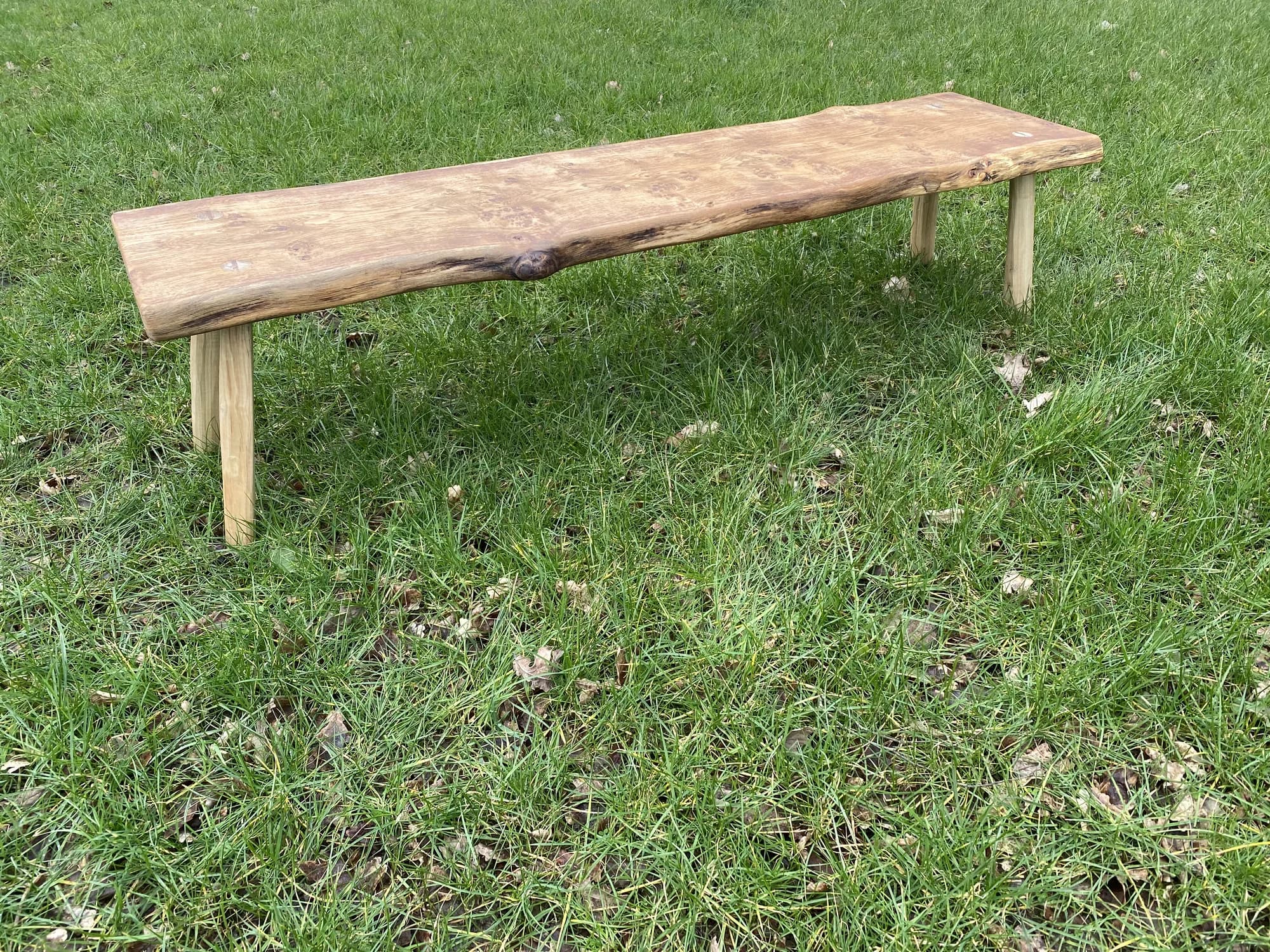 long plank bench on grass