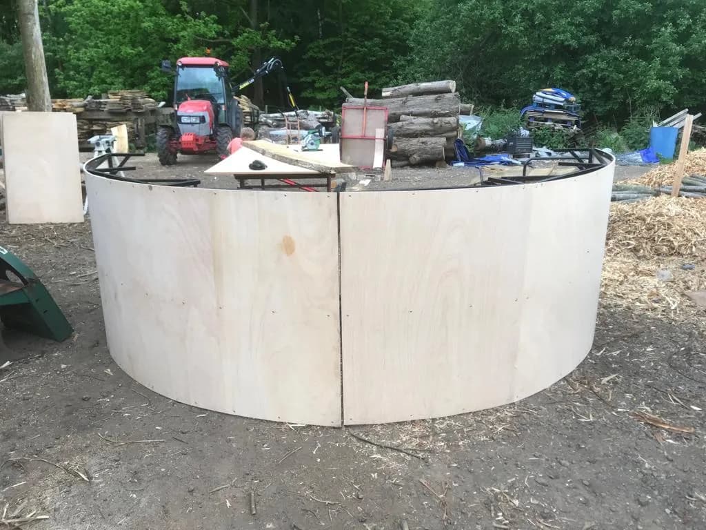 curved plywood bar shell being built